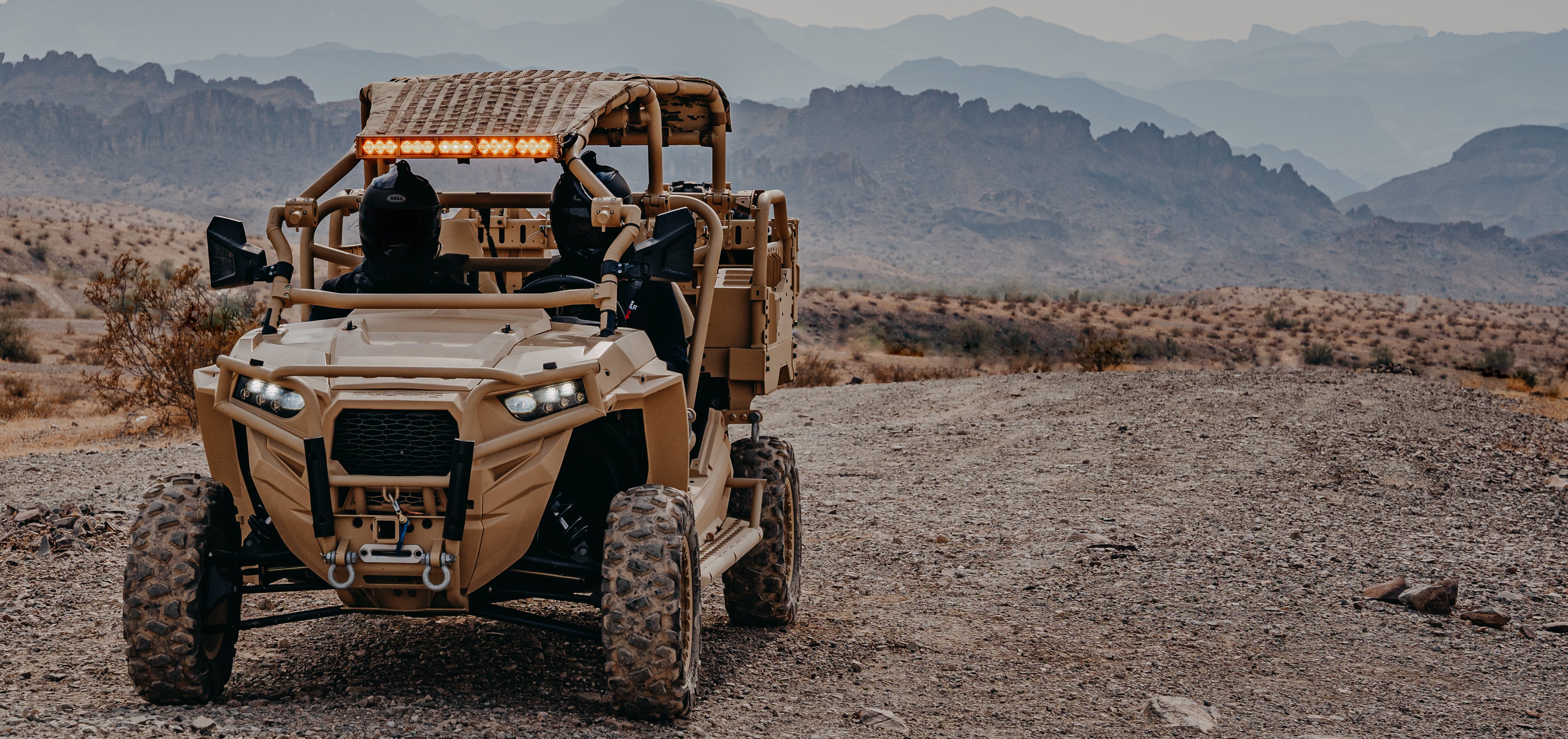 Polaris UTV outfitted with TOMAR LED light bars on it