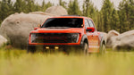 Amber pods mounted on a ford raptor